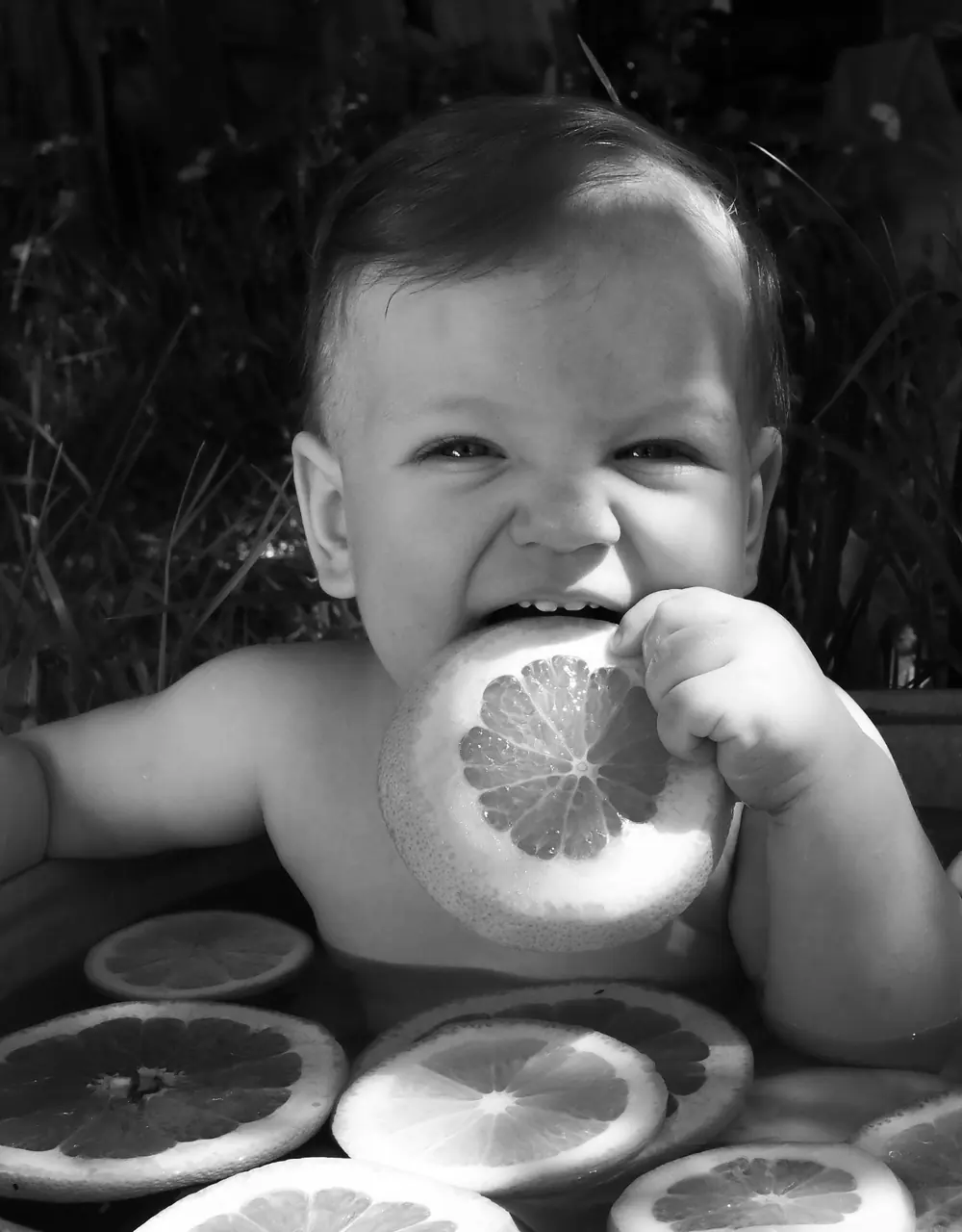 A child laughing in sunlight.